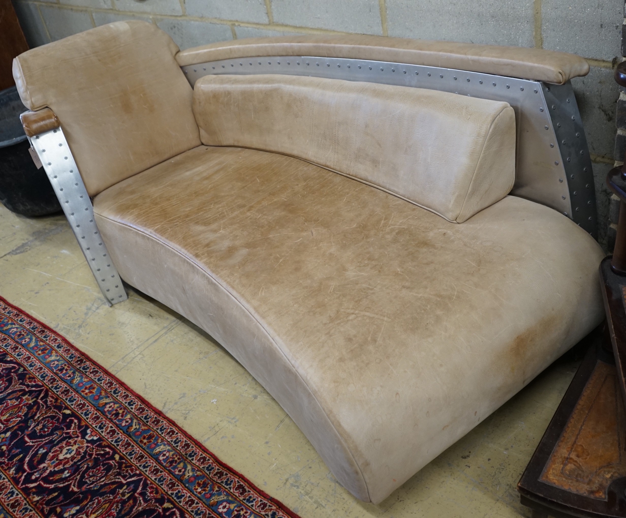 A Timothy Oulton style aluminium and pale brown leather 'Aviator' day bed, length 200cm, width 76cm, height 77cm